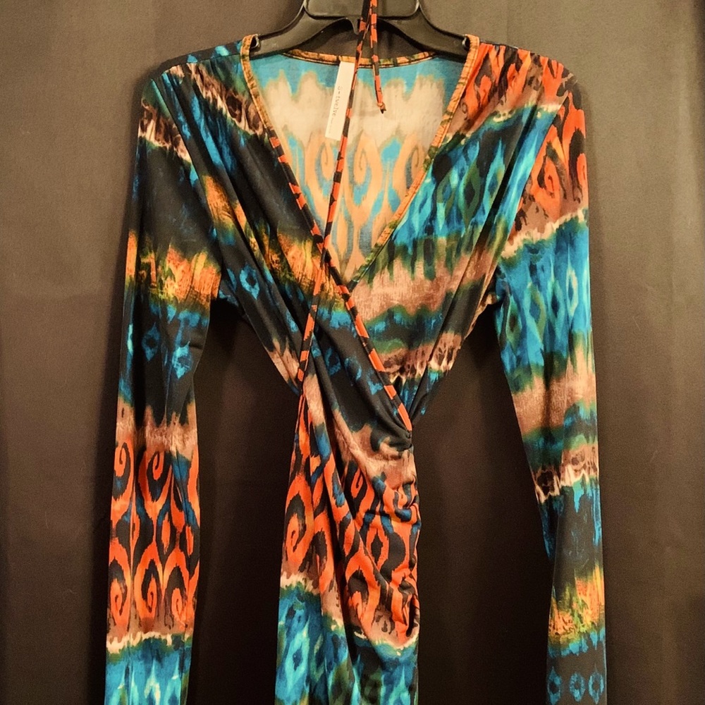 Wrap around knee length dress.